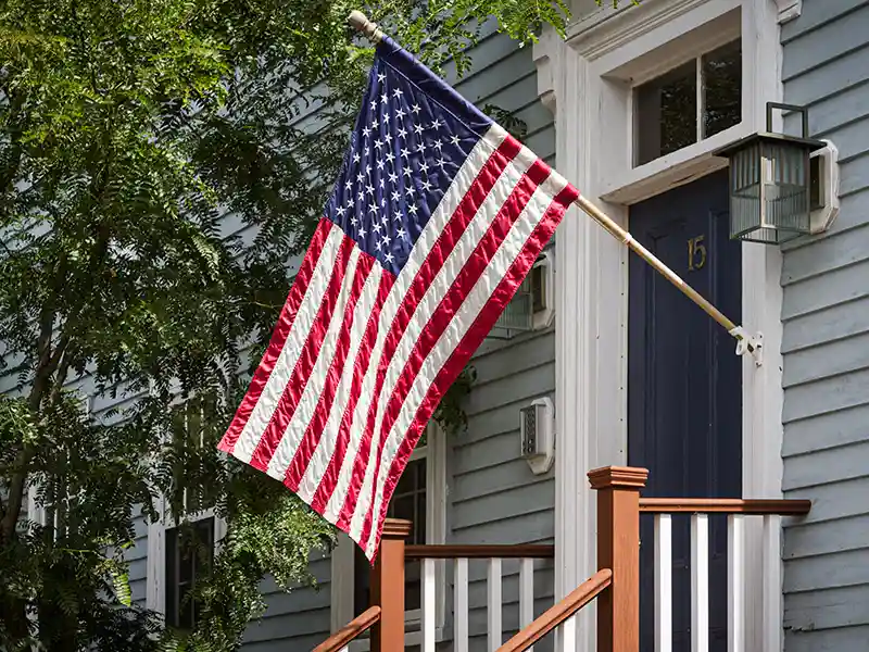 American flag hanging outside a home